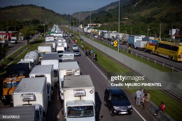 Brazilian truck drivers partially block Santos Dumont road , near the city of Mage, in Rio de Janeiro state, Brazil during a strike to protest...