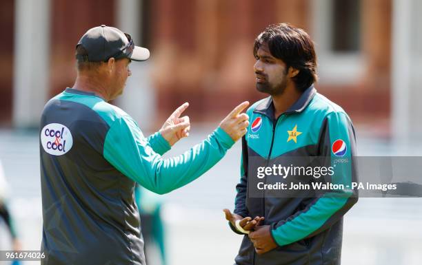 Pakistan's Rahat Ali chats with coach Mickey Arthur during the nets session at Lord's, London.