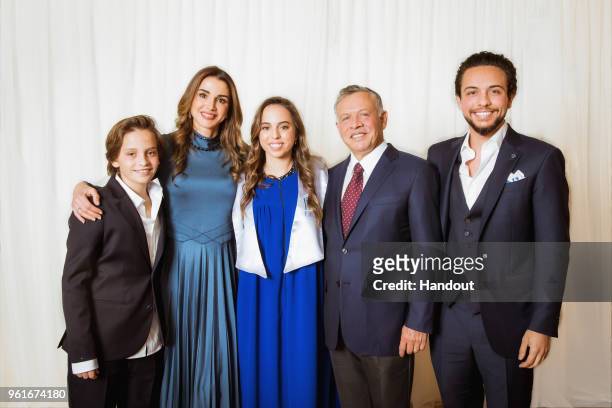 In this handout image provided by the Royal Hashemite Court, Jordan's King Abdullah II , his wife Queen Rania and , Crown Prince Al Hussein and...