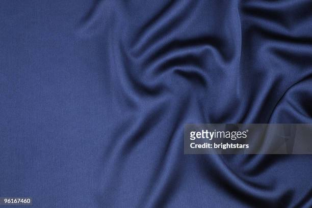 wavy blue satin - sheets stock pictures, royalty-free photos & images