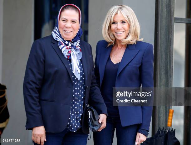 Wife of French President Brigitte Macron accompanies Latifa ibn ziaten after their meeting at the Presidential Palace on May 23, 2018 in Paris,...