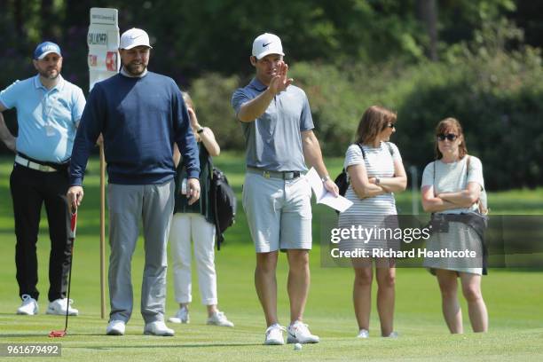 Brian McFadden lines up a putt with Paul Casey of England during the Pro Am for the BMW PGA Championship at Wentworth on May 23, 2018 in Virginia...