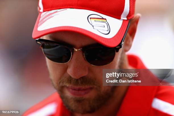 Sebastian Vettel of Germany and Ferrari looks on in the Paddock during previews ahead of the Monaco Formula One Grand Prix at Circuit de Monaco on...