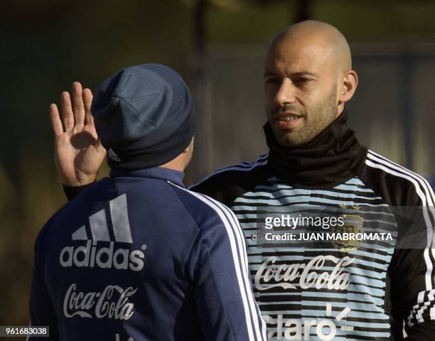 Argentina's national team midfielder Javier Mascherano speaks with head coach Jorge Sampaoli, during a training session in Ezeiza, Buenos Aires on...