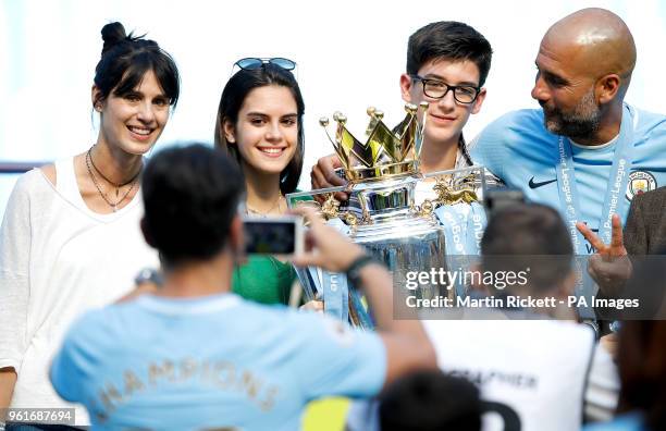 Pep Guardiola celebrates with the trophy and wife Cristina Serra and family
