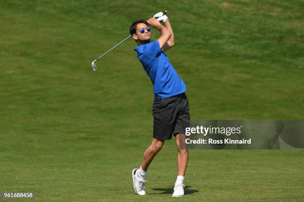 Luke Pasqualino hits an approach during the Pro Am for the BMW PGA Championship at Wentworth on May 23, 2018 in Virginia Water, England.