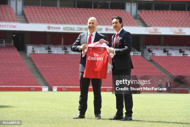 New Arsenal Head Coach Unai Emery with CEO Ivan Gazidis on the pitch at Emirates Stadium on May 23, 2018 in London, England.