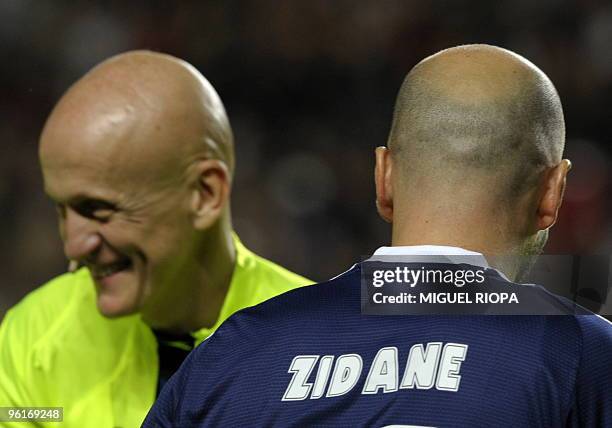 French football legend Zinedine Zidane salutes former referee Italian Pierluigi Collina before the VII Match Against Poverty friendly football match...