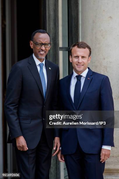 French President Emmanuel Macron welcomes the President of the Republic of Rwanda, Paul Kagame at Elysee Palace on May 23, 2018 in Paris, France....