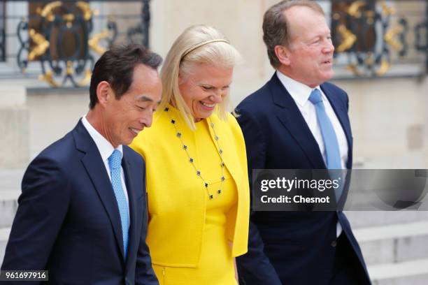 Samsung CEO Young Sohn and IBM President and CEO Virginia Rometty and former CEO of Cisco Systems, John Chambers leave the Elysee Presidential Palace...