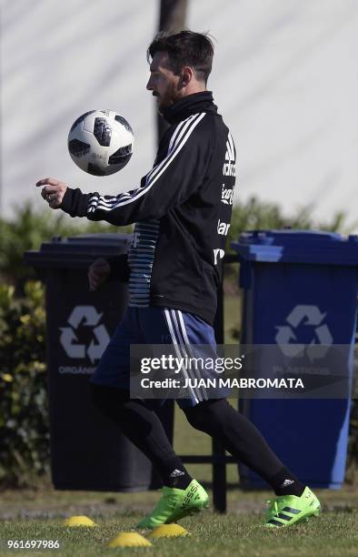 Argentina's national football team forward Lionel Messi, controls the ball during a training session in Ezeiza, Buenos Aires on May 23, 2018. - The...