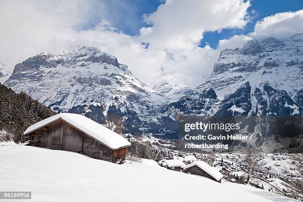 grindelwald and the wetterhorn mountain, jungfrau region, bernese oberland, swiss alps, switzerland, europe - wetterhorn stock pictures, royalty-free photos & images