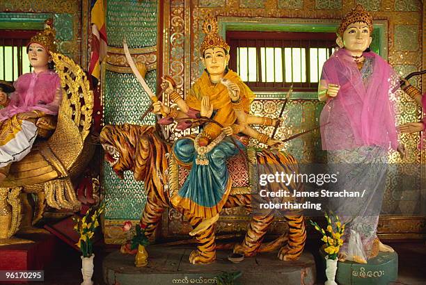 shrine to all 37 nats at base of hill, mount popa, myanmar (burma), asia - james lord stock pictures, royalty-free photos & images