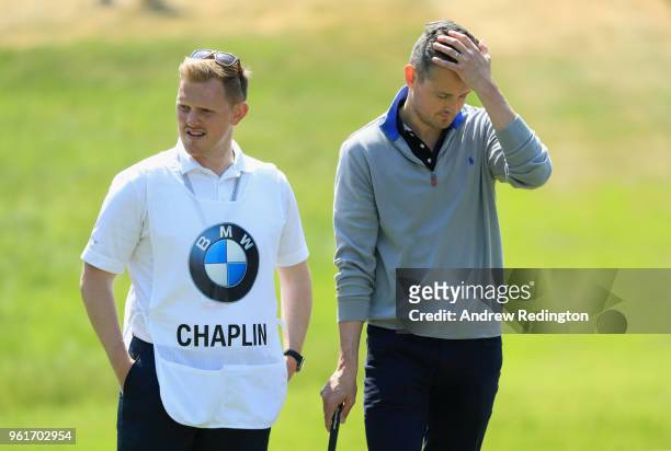 Musician Tom Chaplin and caddie look on during the BMW PGA Championship Pro Am tournament at Wentworth on May 23, 2018 in Virginia Water, England.