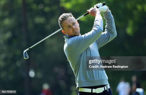 Musician Tom Chaplin plays a shot during the BMW PGA Championship Pro Am tournament at Wentworth on May 23, 2018 in Virginia Water, England.