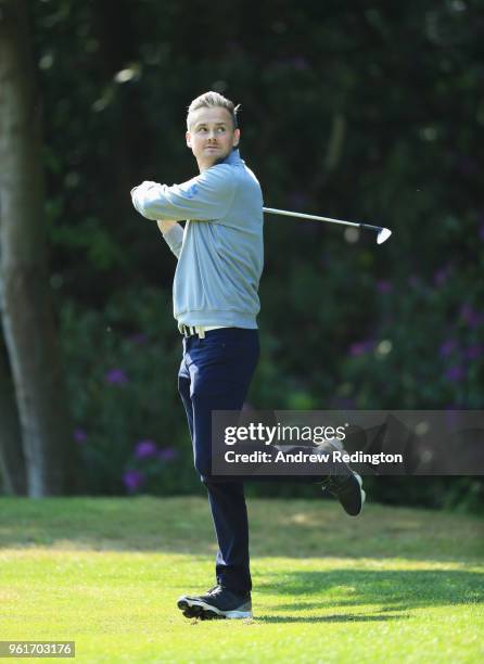 Musician Tom Chaplin plays a shot during the BMW PGA Championship Pro Am tournament at Wentworth on May 23, 2018 in Virginia Water, England.