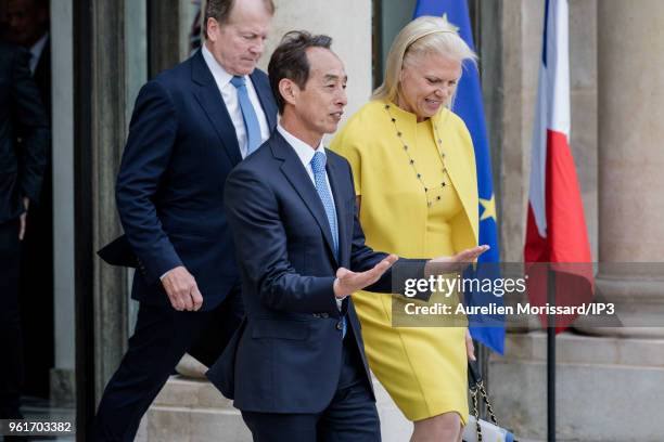 Samsung CEO, Young Sohn and IBM CEO, Virginia Rometty, leave after the "Tech for Good" Summit at Elysee Palace on May 23, 2018 in Paris, France. On...