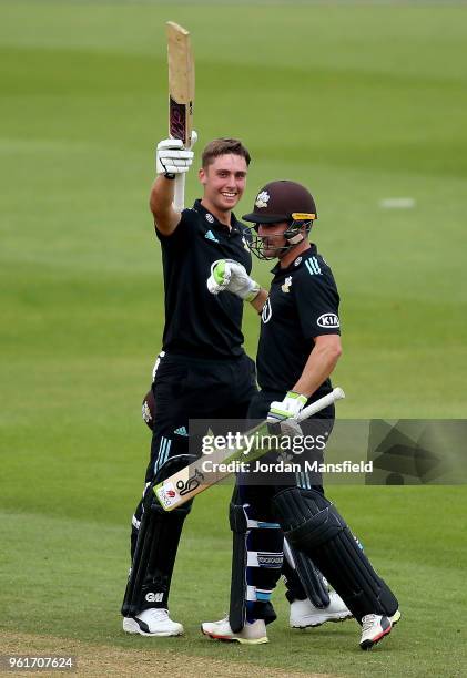 Will Jacks of Surrey celebrates his century with Dean Elgar of Surrey during the Royal London One-Day Cup match between Surrey and Gloucestershire at...