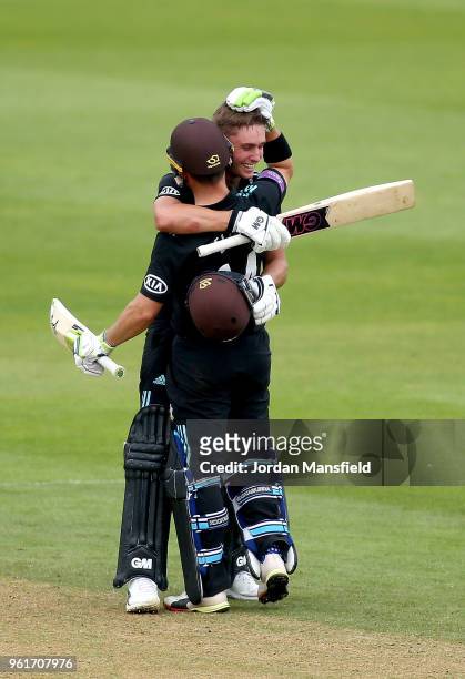 Will Jacks of Surrey celebrates his century with Dean Elgar of Surrey during the Royal London One-Day Cup match between Surrey and Gloucestershire at...