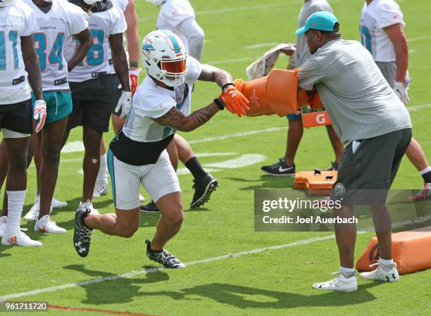 Kenny Stills of the Miami Dolphins runs a drill during the teams training camp on May 23, 2018 at the Miami Dolphins training facility in Davie,...