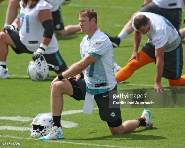 Ryan Tannehill of the Miami Dolphins stretches during the teams training camp on May 23, 2018 at the Miami Dolphins training facility in Davie,...