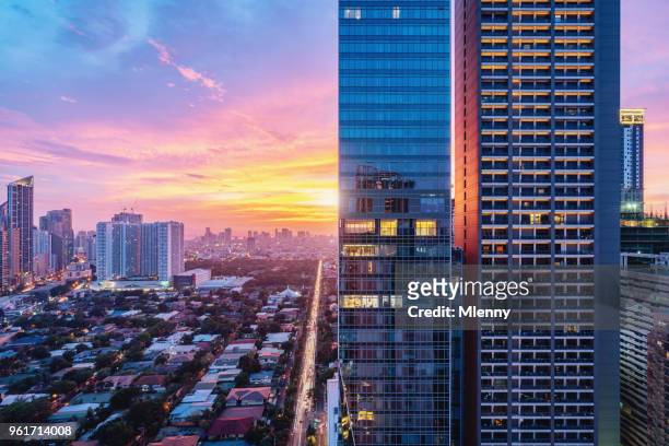 colorful sunset makati skyscraper metro manila philippines - philippines stock pictures, royalty-free photos & images