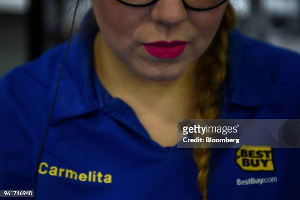 Best Buy Co. Signage is displayed on an employee's shirt at a store in San Antonio, Texas, U.S., on Thursday, May 17, 2018. Best Buy Co. Is scheduled...