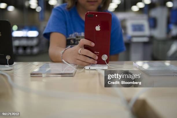 Customer views an Apple Inc. IPhone on display for sale at a Best Buy Co. Store in San Antonio, Texas, U.S., on Thursday, May 17, 2018. Best Buy Co....