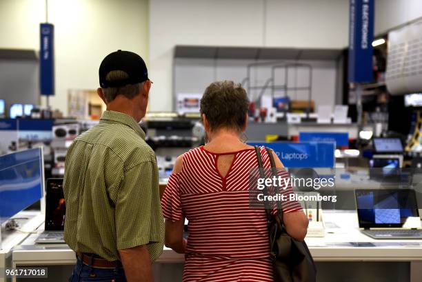 Customers view laptop computers on display for sale at a Best Buy Co. Store in San Antonio, Texas, U.S., on Thursday, May 17, 2018. Best Buy Co. Is...