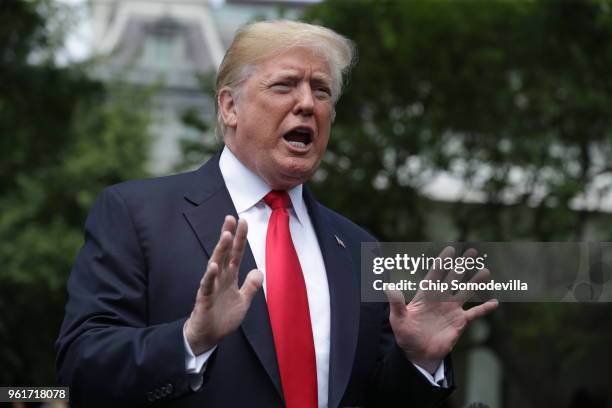 President Donald Trump speaks to the media as he walks across the South Lawn while departing the White House May 23, 2018 in Washington, DC. Trump is...