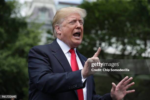 President Donald Trump speaks to the media as he walks across the South Lawn while departing the White House May 23, 2018 in Washington, DC. Trump is...