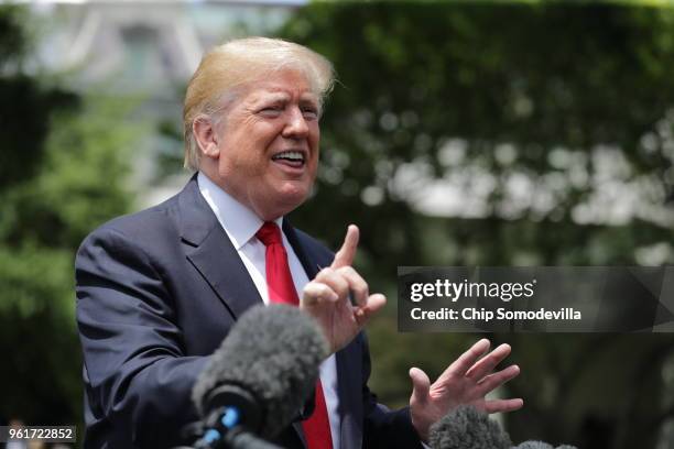 President Donald Trump speaks to the media as he walks across the South Lawn while departing the White House May 23, 2018 in Washington, DC. Trump is...