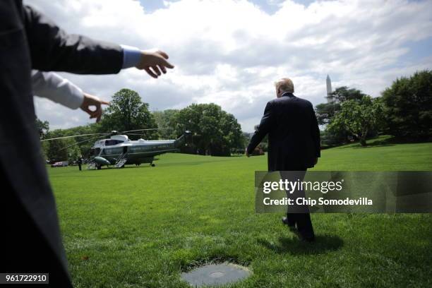 President Donald Trump walks across the South Lawn while departing the White House May 23, 2018 in Washington, DC. Trump is traveling to New York...