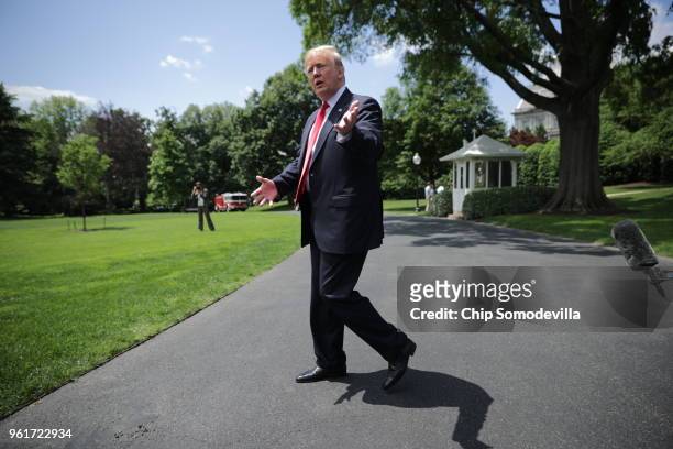 President Donald Trump walks across the South Lawn while departing the White House May 23, 2018 in Washington, DC. Trump is traveling to New York...