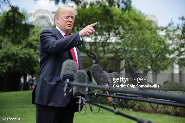 President Donald Trump speaks to the media as he walks across the South Lawn while departing the White House May 23, 2018 in Washington, DC. Trump is...
