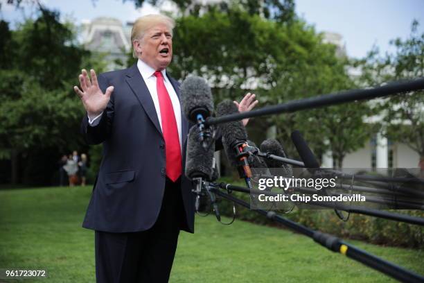 President Donald Trump speaks to the media as he walks across the South Lawn while departing the White House May 23, 2018 in Washington, DC. Trump is...