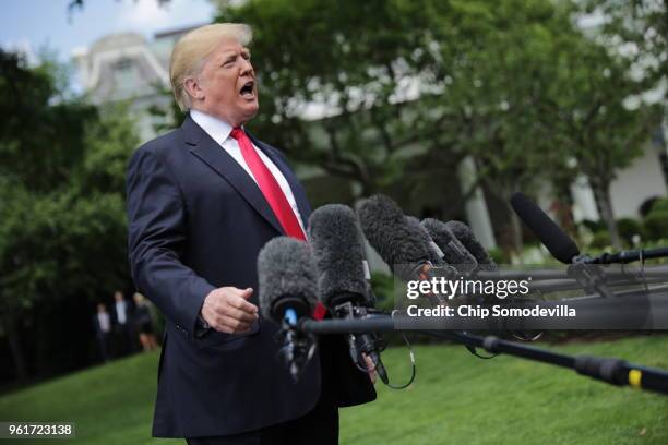 President Donald Trump speaks to the media as he walks across the South Lawn while departing the White House May 23, 2018 in Washington, DC. Trump is...
