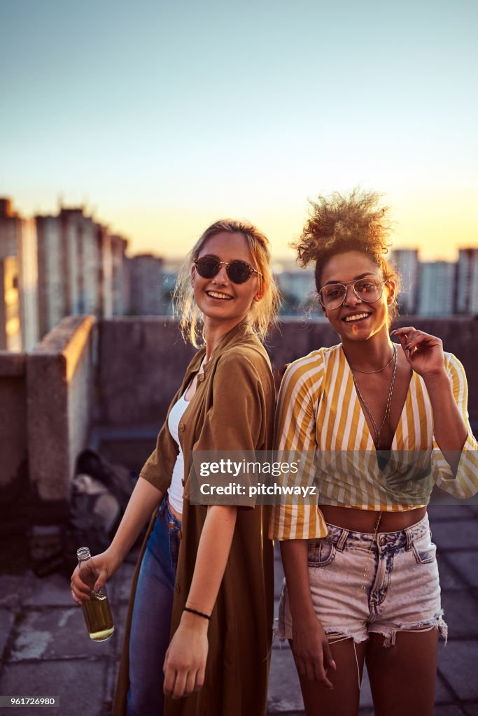 Two women dancing at the party.