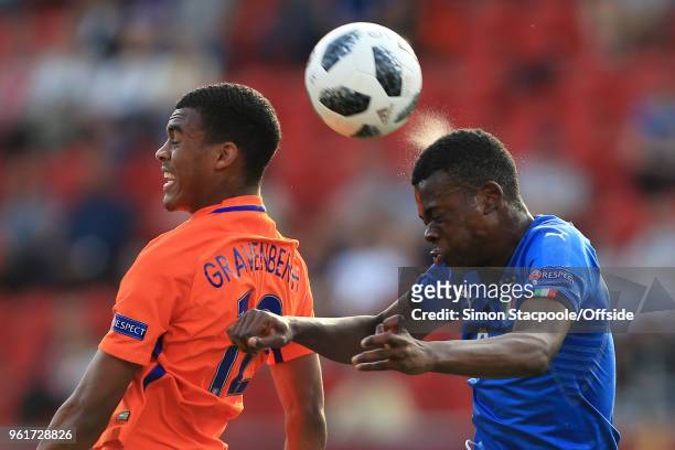 Ryan Gravenberg of Netherlands battles with Paolo Gozzi Iweru of Italy during the UEFA European Under-17 Championship Final match between Italy and...