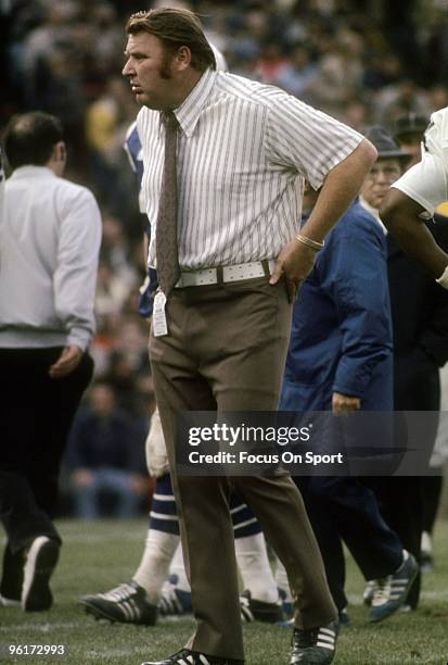 John Madden head coach of the Oakland Raiders watches the action from the sideline during a mid circa 1970s NFL football game. Madden coached the...