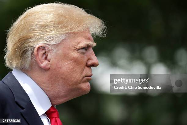 President Donald Trump talks to journalists before departing the White House May 23, 2018 in Washington, DC. Trump is traveling to New York where he...