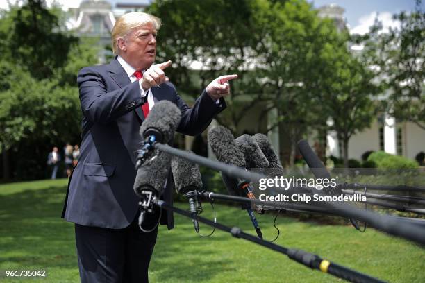 President Donald Trump talks to journalists before departing the White House May 23, 2018 in Washington, DC. Trump is traveling to New York where he...