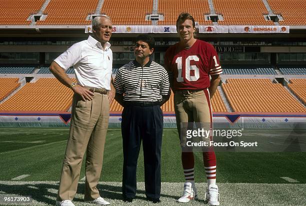 Quarterback Joe Montana, owner Eddie DeBartolo Jr., and head coach Bill Walsh of the San Francisco 49ers poses together for this photo before super...