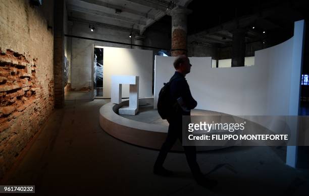Person visits "Evasao" by Portugal's Alvaro Siza as part of the 16th International Architecture Exhibition in Venice, on May 23, 2018. The Biennale...