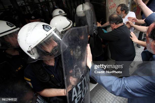Demonstration against electronic property auctions in Athens, Greece on May 23, 2018. Protesters attempt to break into the notary office and prevent...