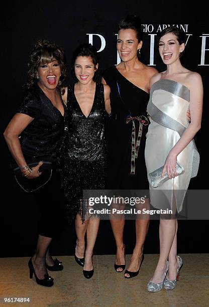 Singer Tina Turner Actresses Elsa Pataky and Anne Hathaway pose with Roberta Armani as they attend Giorgio Armani Prive Fashion Show during Paris...