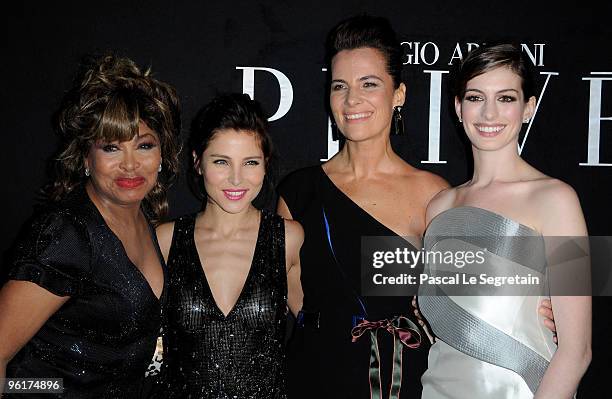 Singer Tina Turner Actresses Elsa Pataky and Anne Hathaway pose with Roberta Armani as they attend Giorgio Armani Prive Fashion Show during Paris...