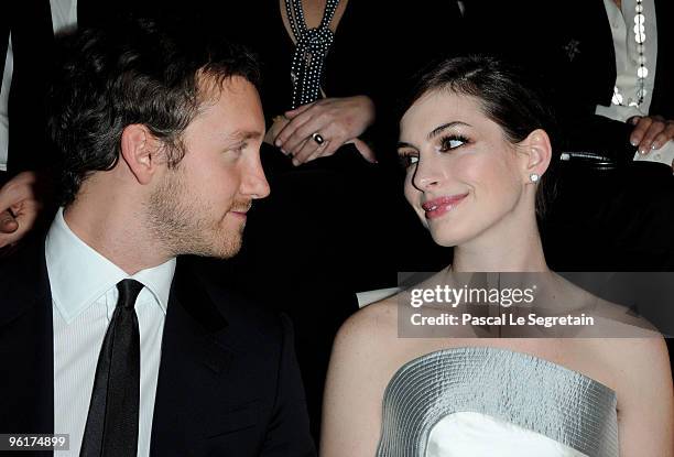 Actor Adam Schulman and Actress Anne Hathaway attend Giorgio Armani Prive Fashion Show during Paris Fashion Week Haute Couture S/S 2010 at Palais de...