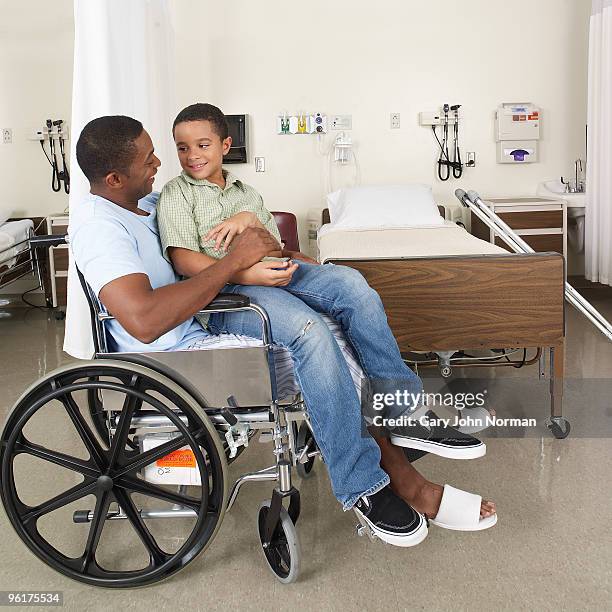 son visits father in hospital - gary bond stock pictures, royalty-free photos & images