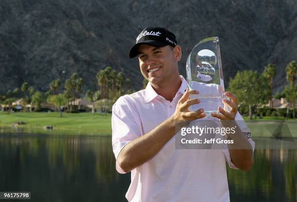 Bill Haas poses with the trophy after winning the Bob Hope Classic at the Palmer Private Course at PGA West on January 25, 2010 in La Quinta,...